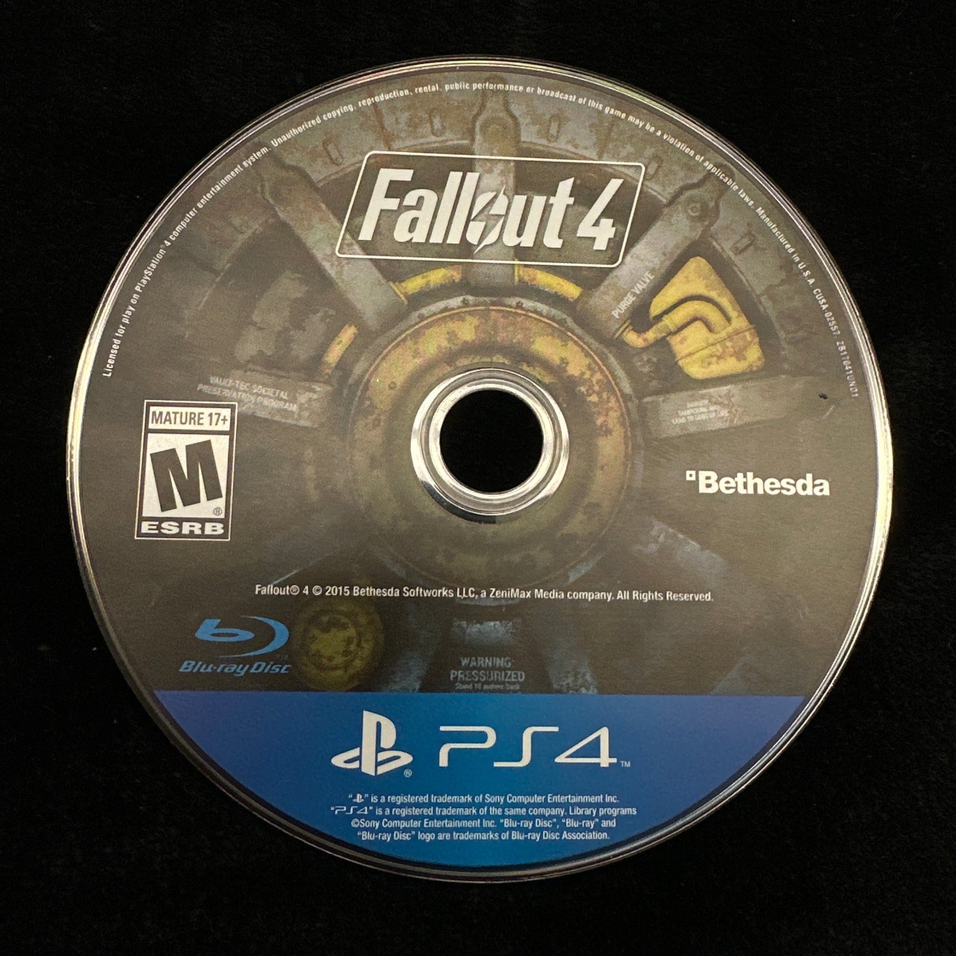 Game disc for 'Fallout 4' on a black background