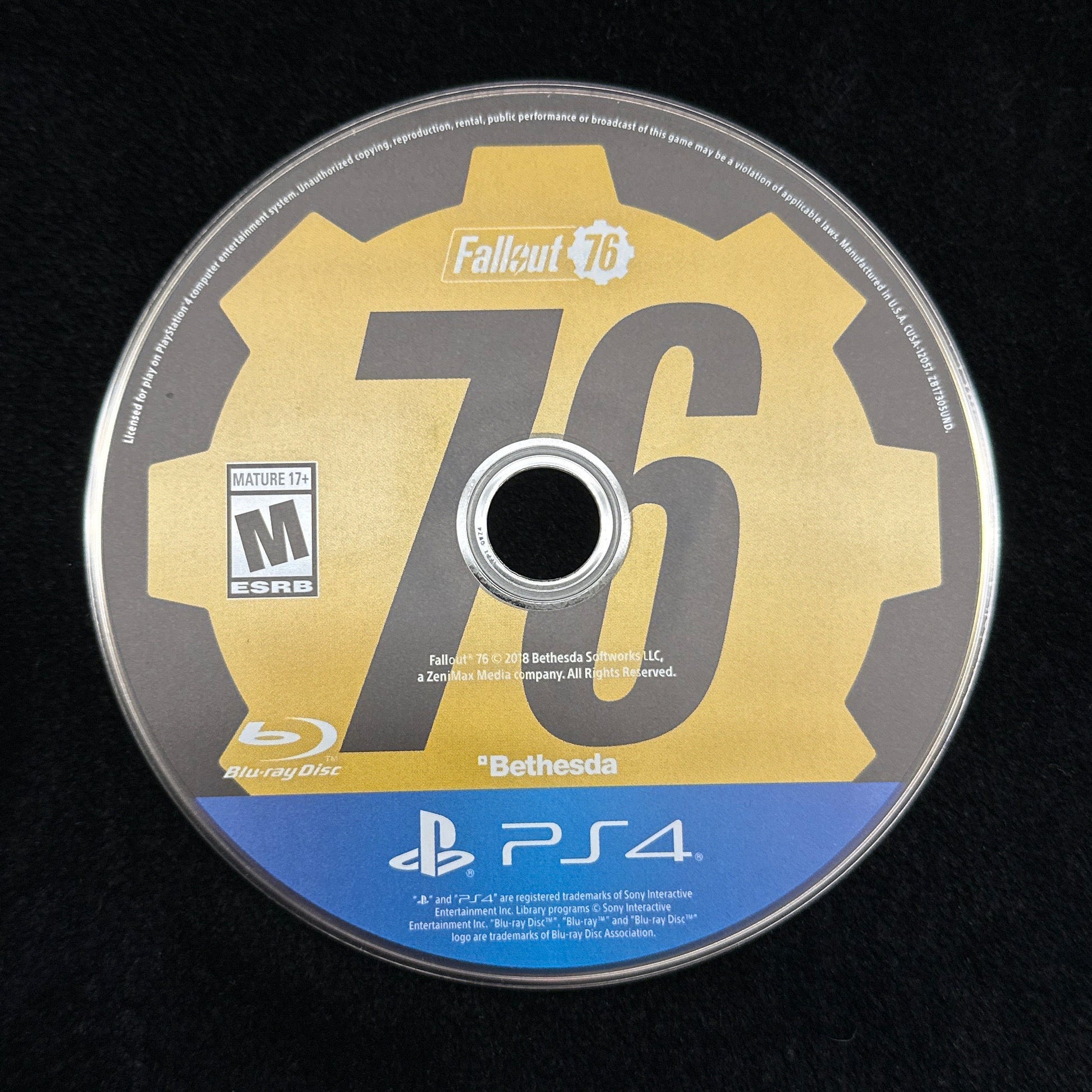 PlayStation 4 game disc on a black background