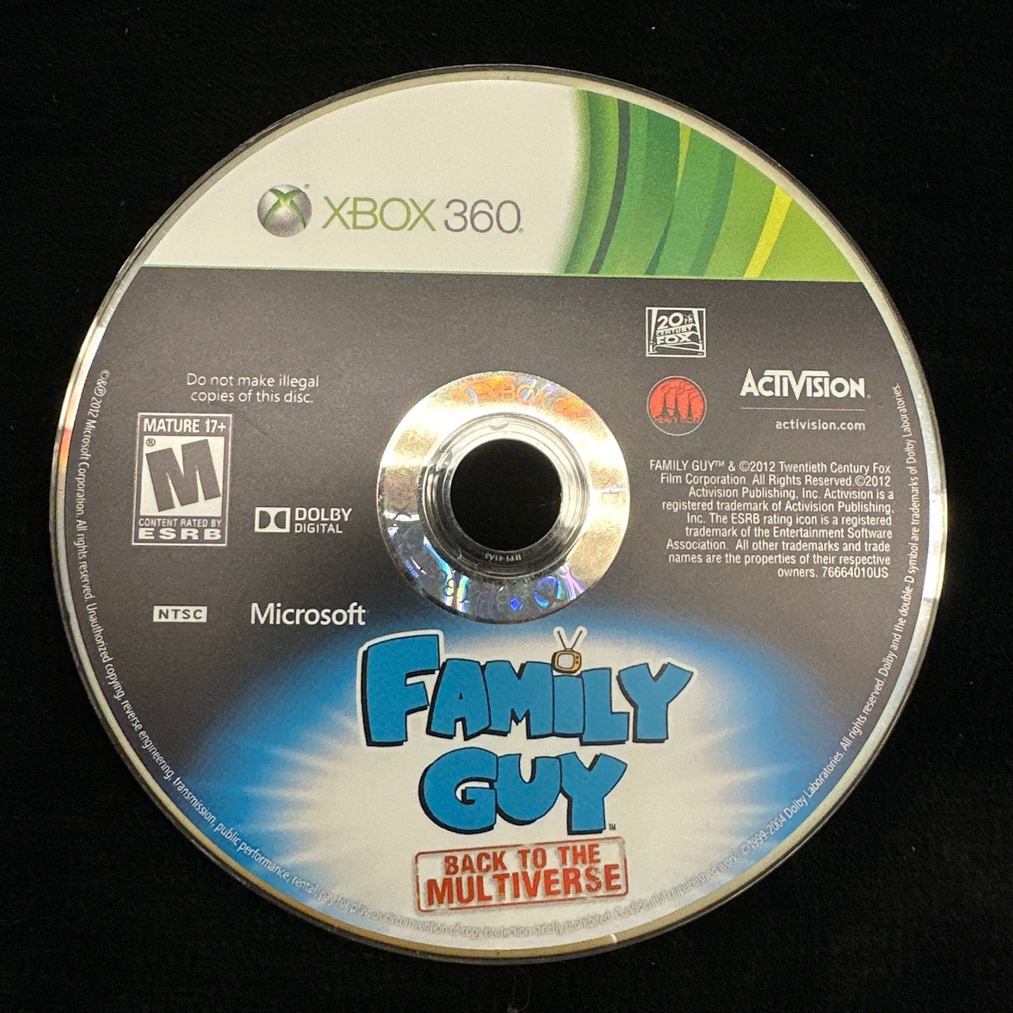 Game disc for 'Family Guy The Multiverse' on Xbox 360 with Activision branding on a black background