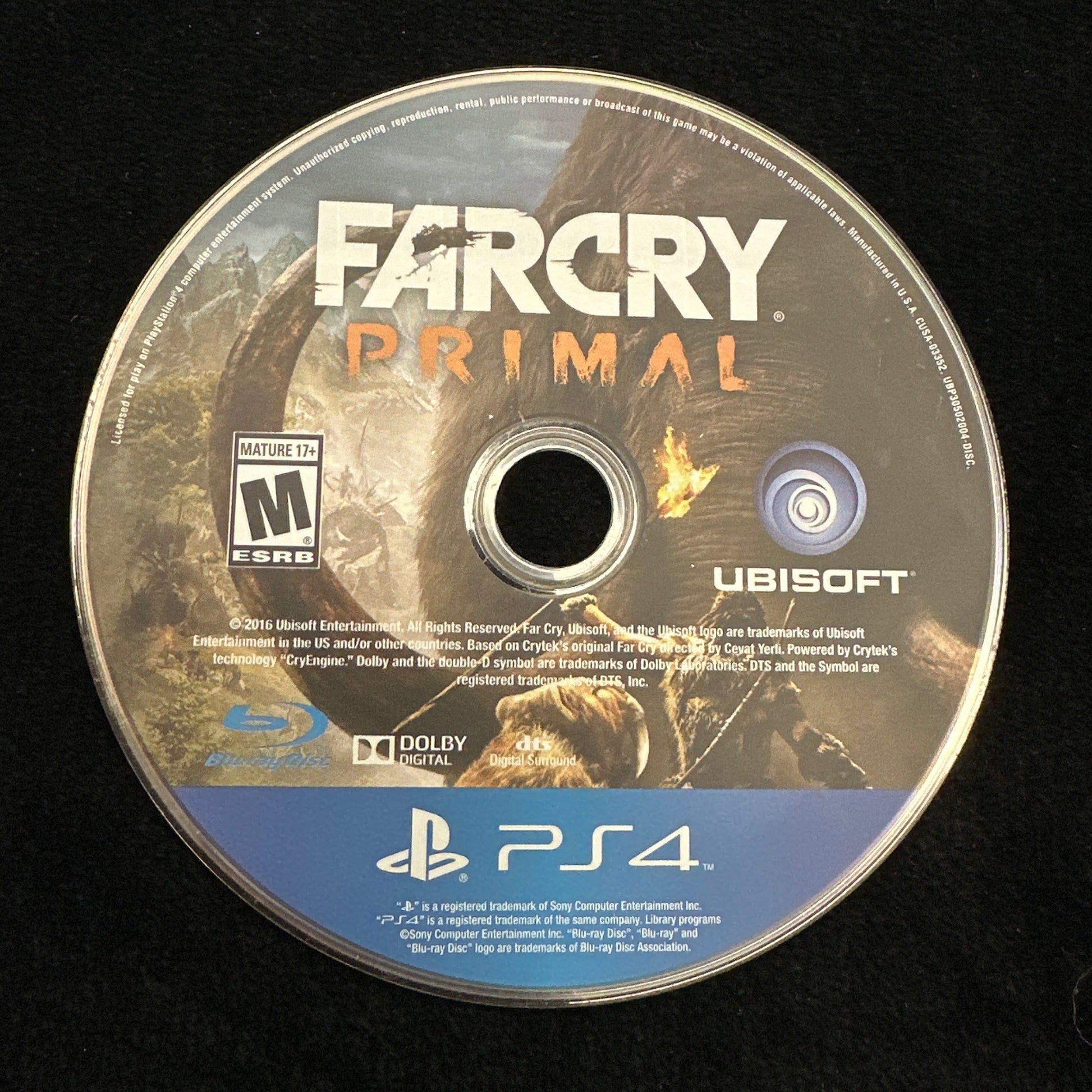 Game disc for 'Far Cry Primal' on a black background