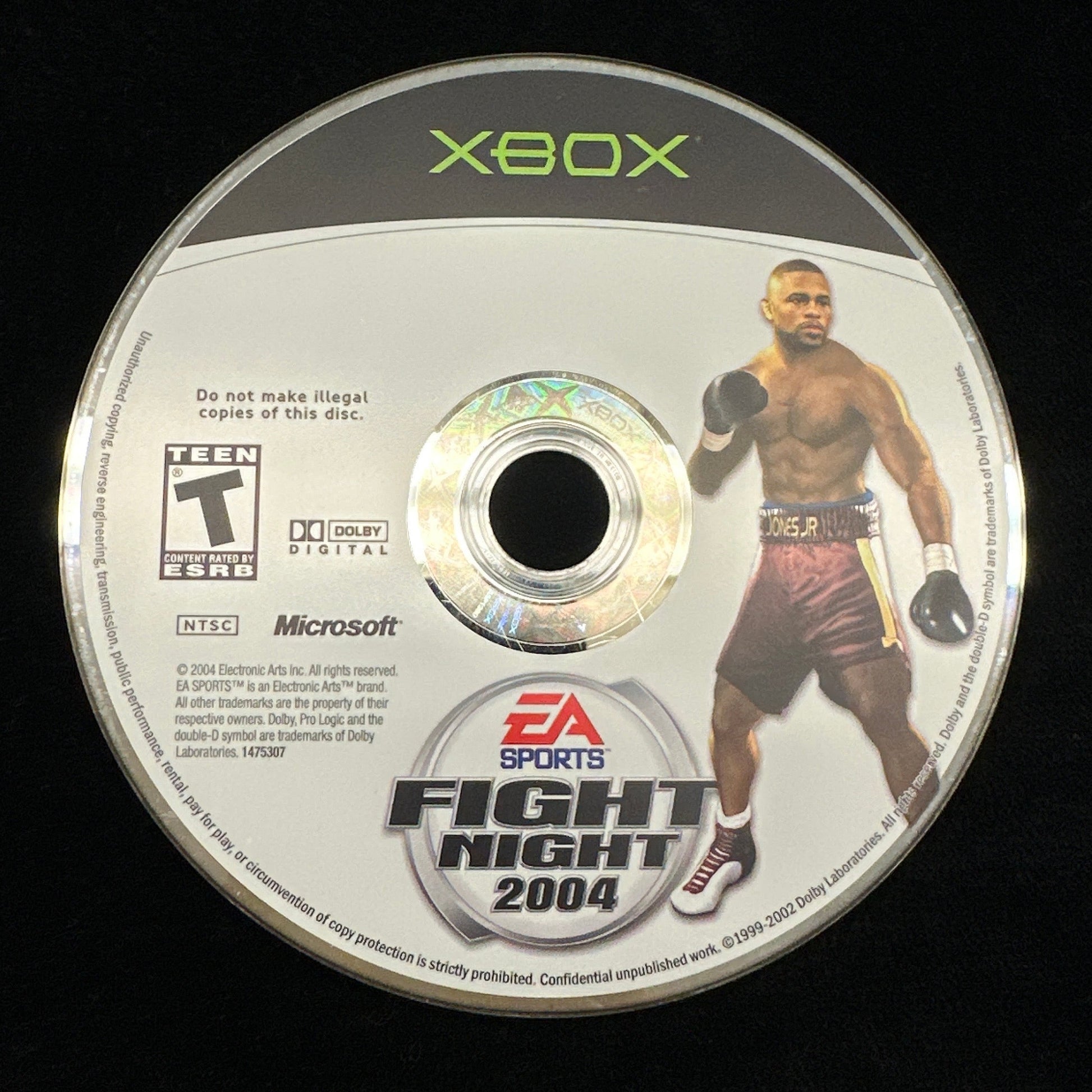 Game disc for 'Xbox Sports Fight Night 2004' on a black background