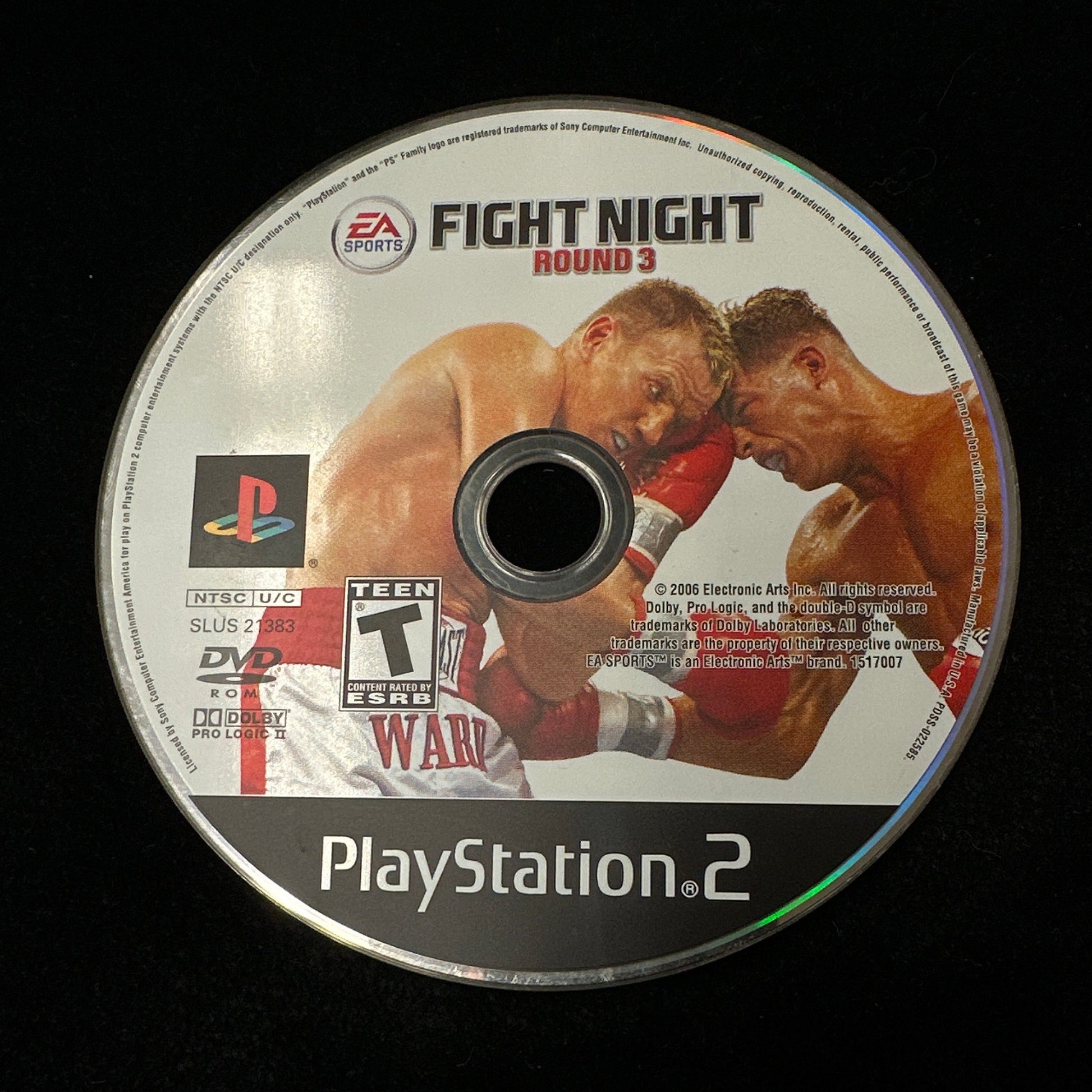 PlayStation 2 game disc with boxing graphics on a black background