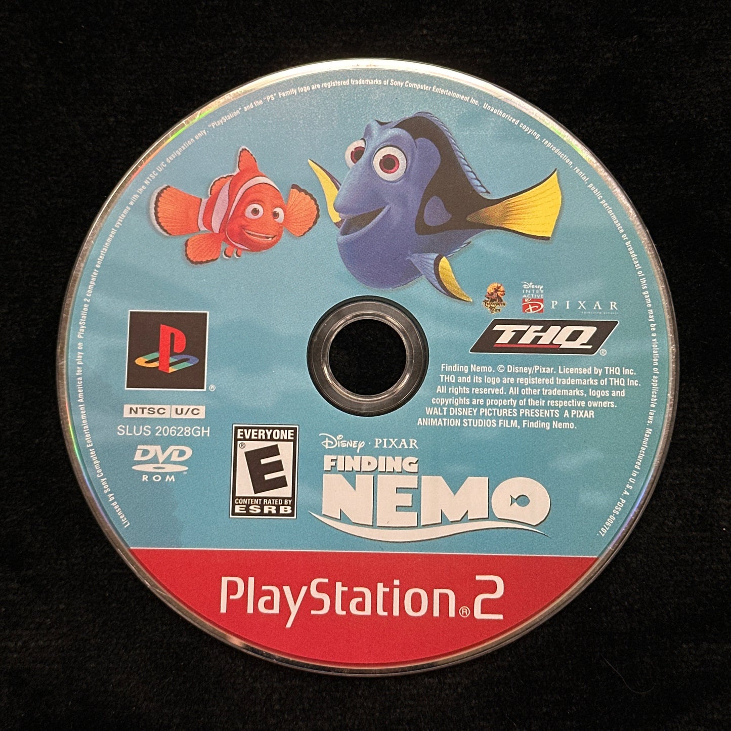 Game disc for 'Finding Nemo' on a PlayStation 2 console with characters from the movie.