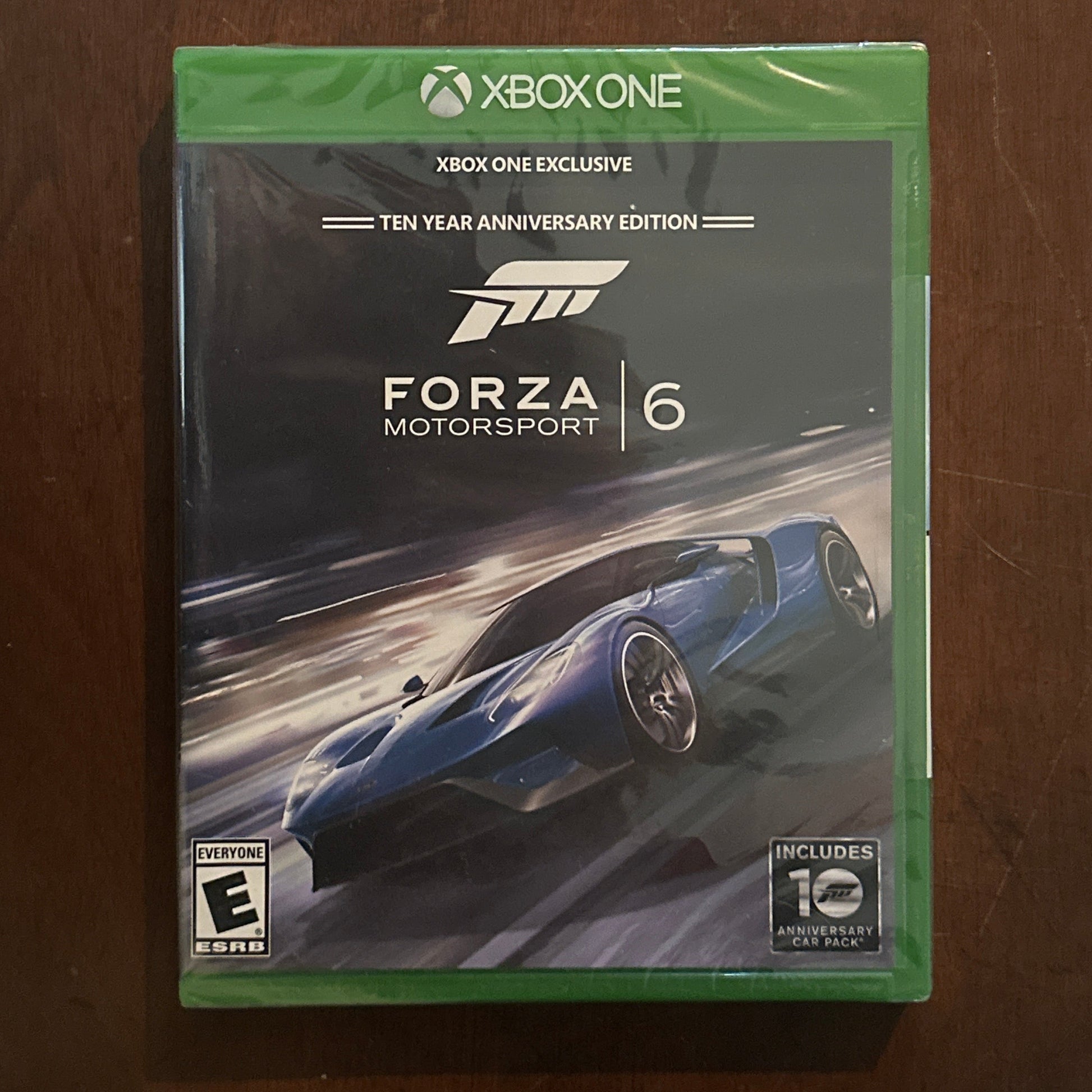 Forza Motorsport 6 game case for Xbox One on a wooden surface