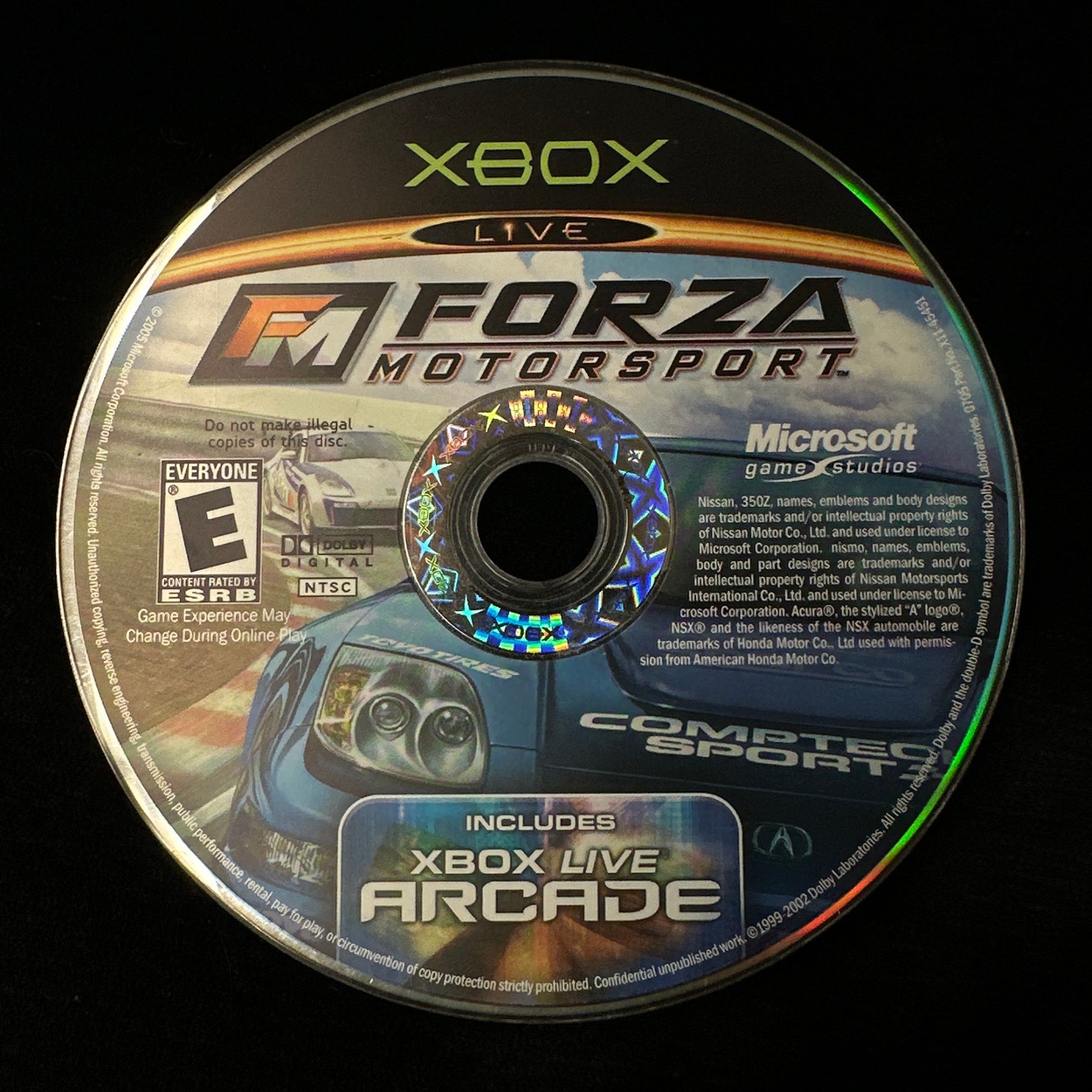Game disc for 'Forza Motorsport' on Xbox with branding and game information.