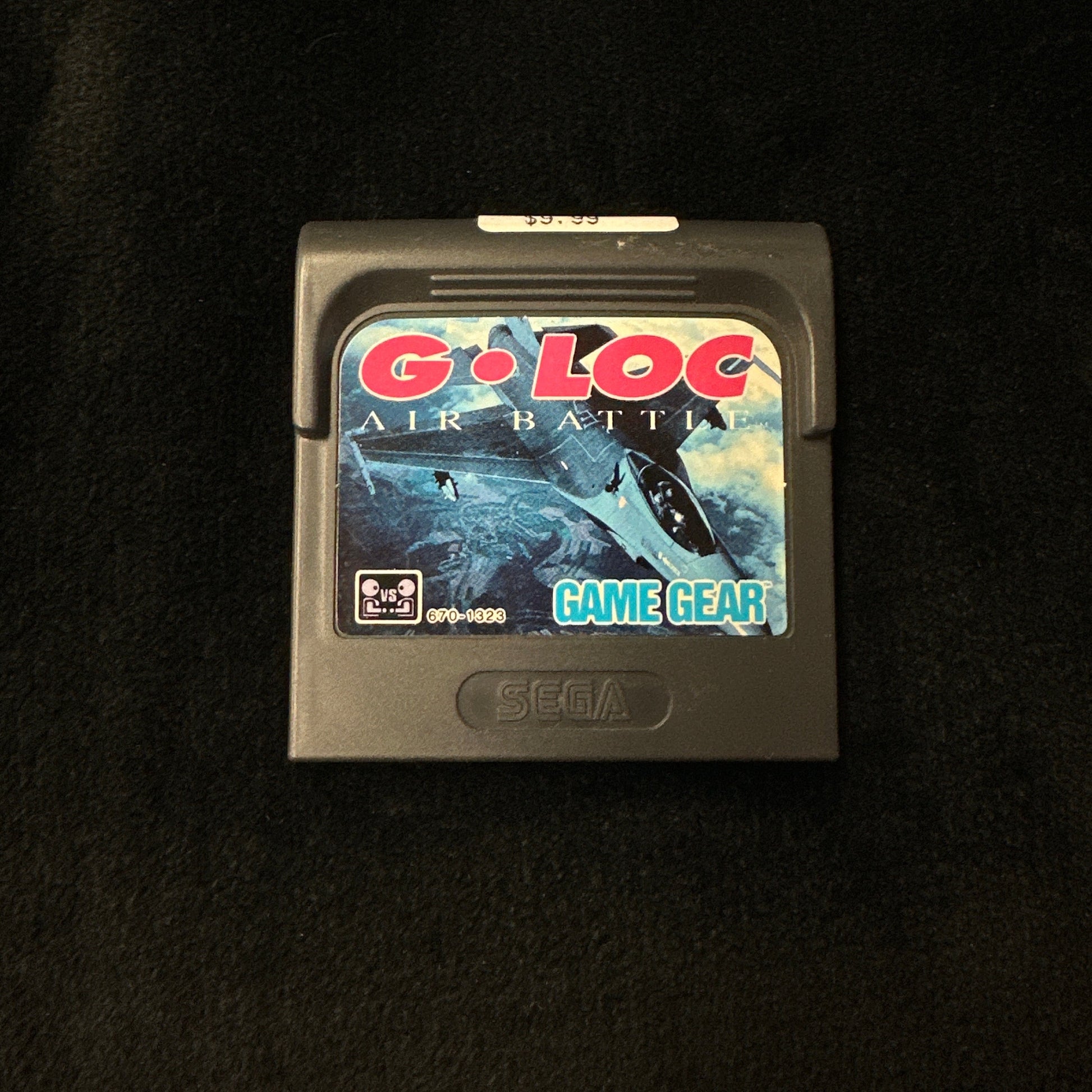 G-LOC game cartridge on a dark surface