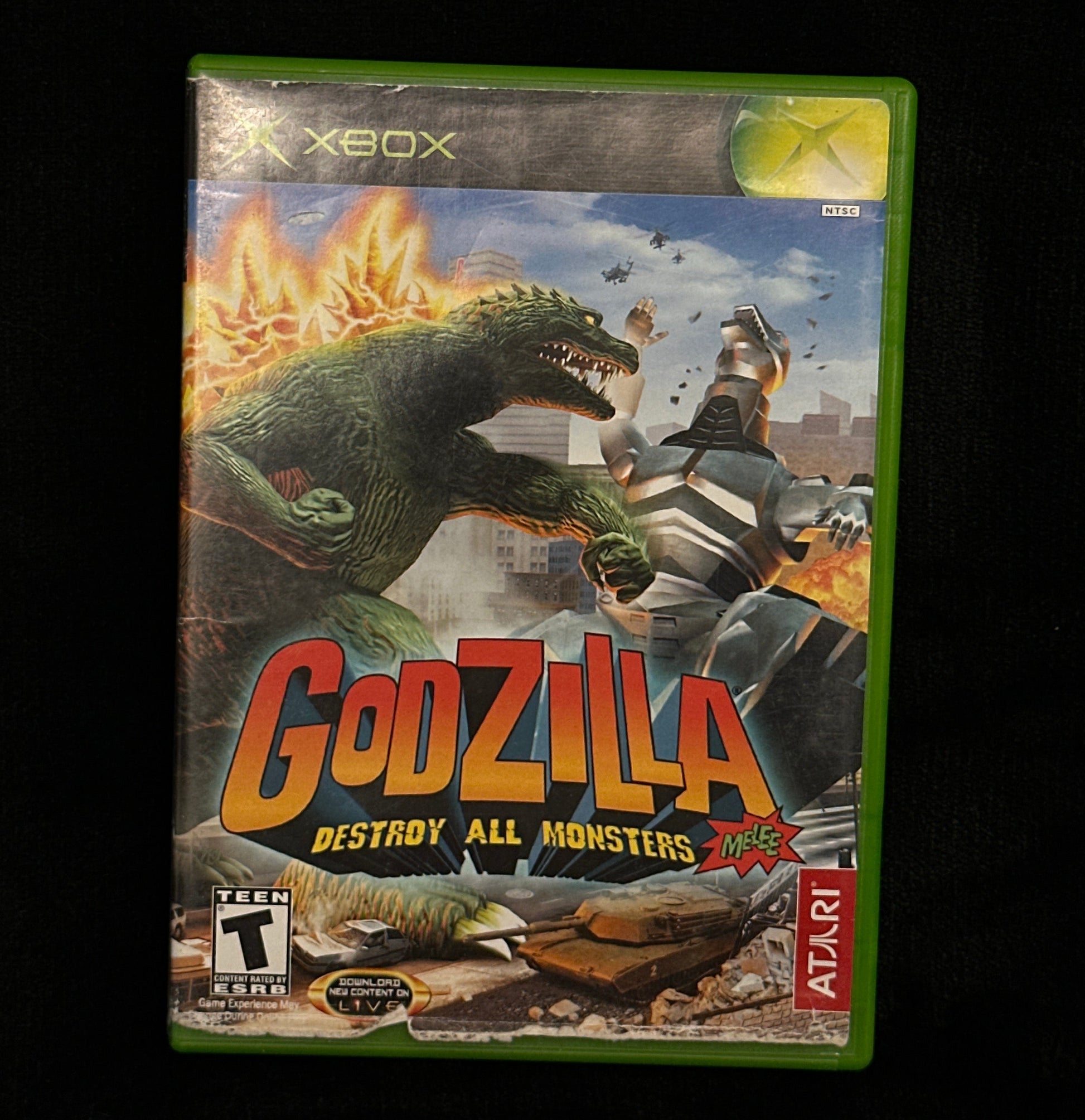 Vintage 'Godzilla' video game case for Xbox Atari on a black background