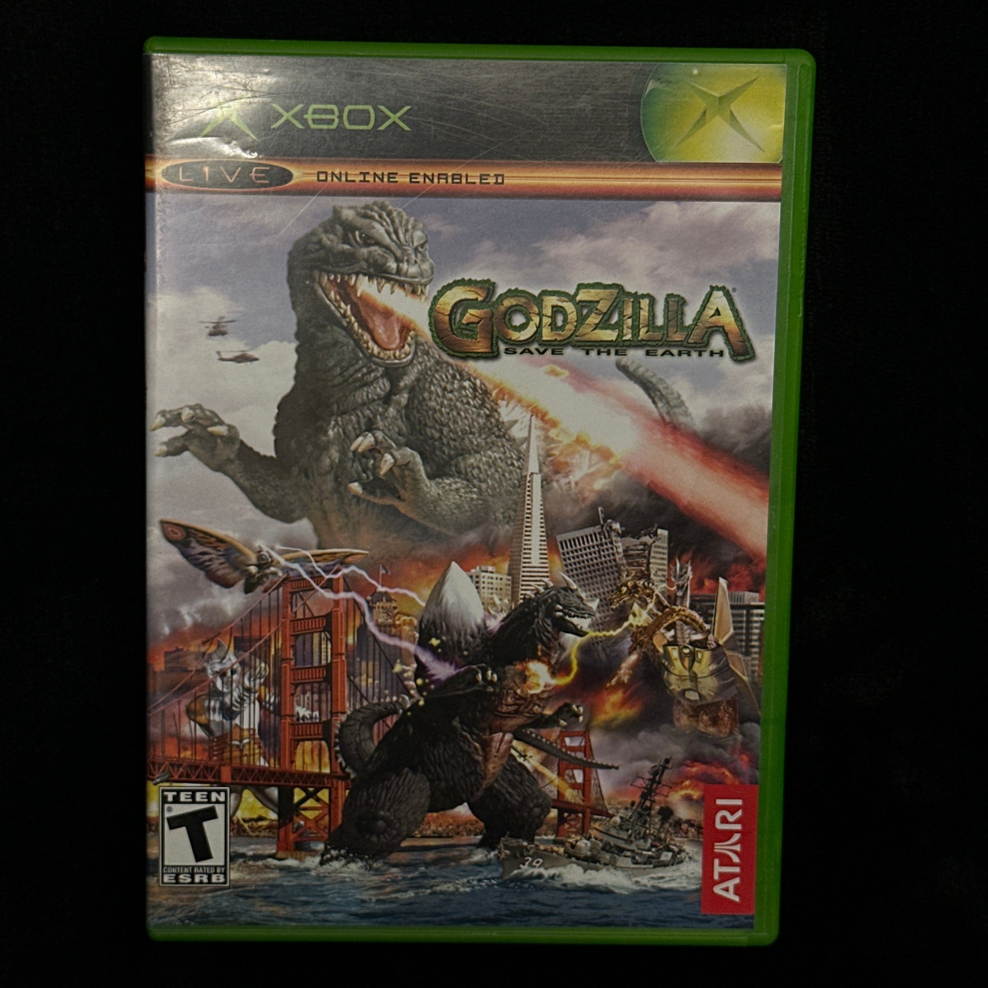 Xbox game case for 'Godzilla' on a black background