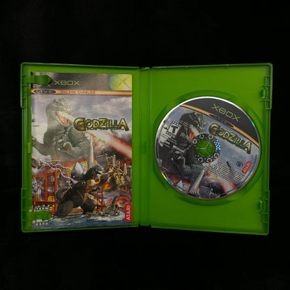 Xbox game disc in a green case on a dark background