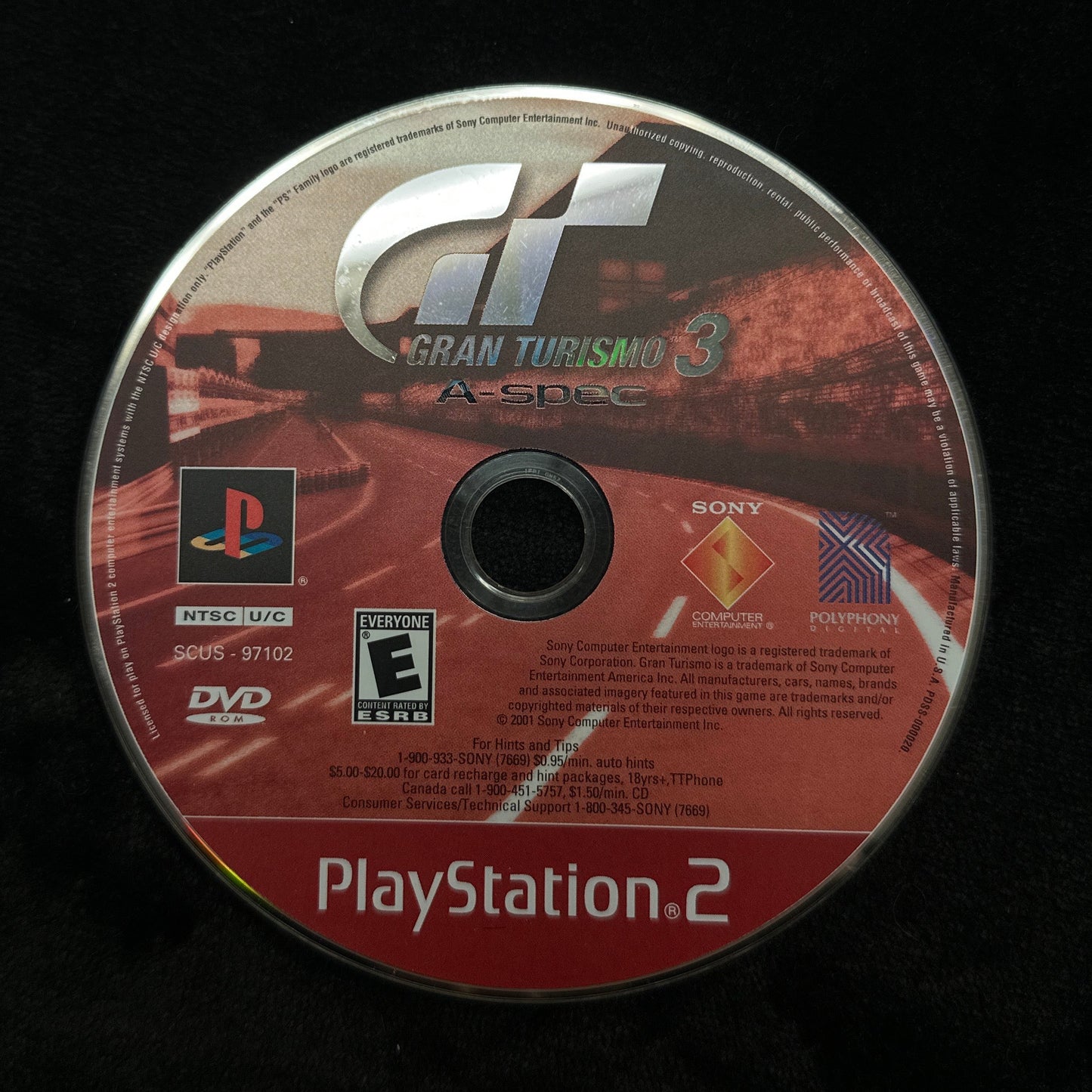 PlayStation 2 game disc on a black background