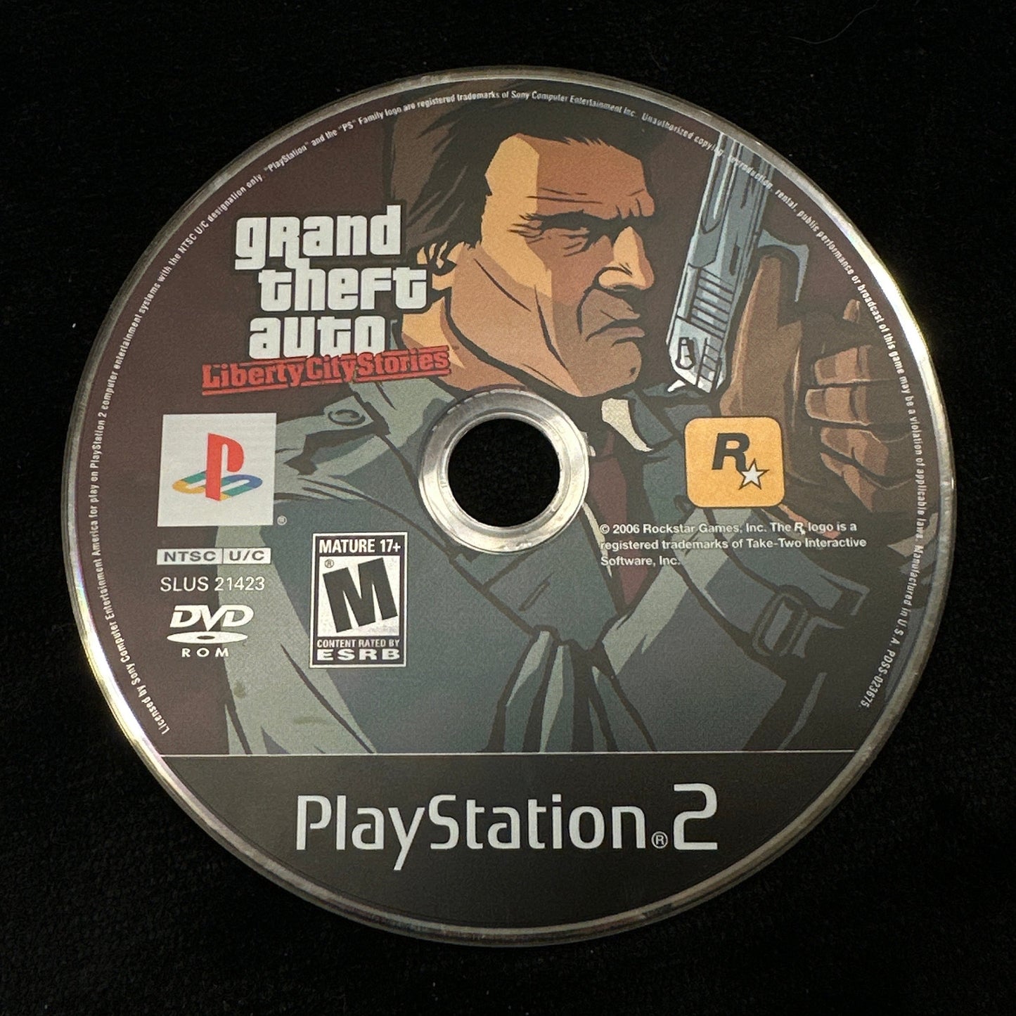 PlayStation 2 game disc for 'Grand Theft Auto' on a black background