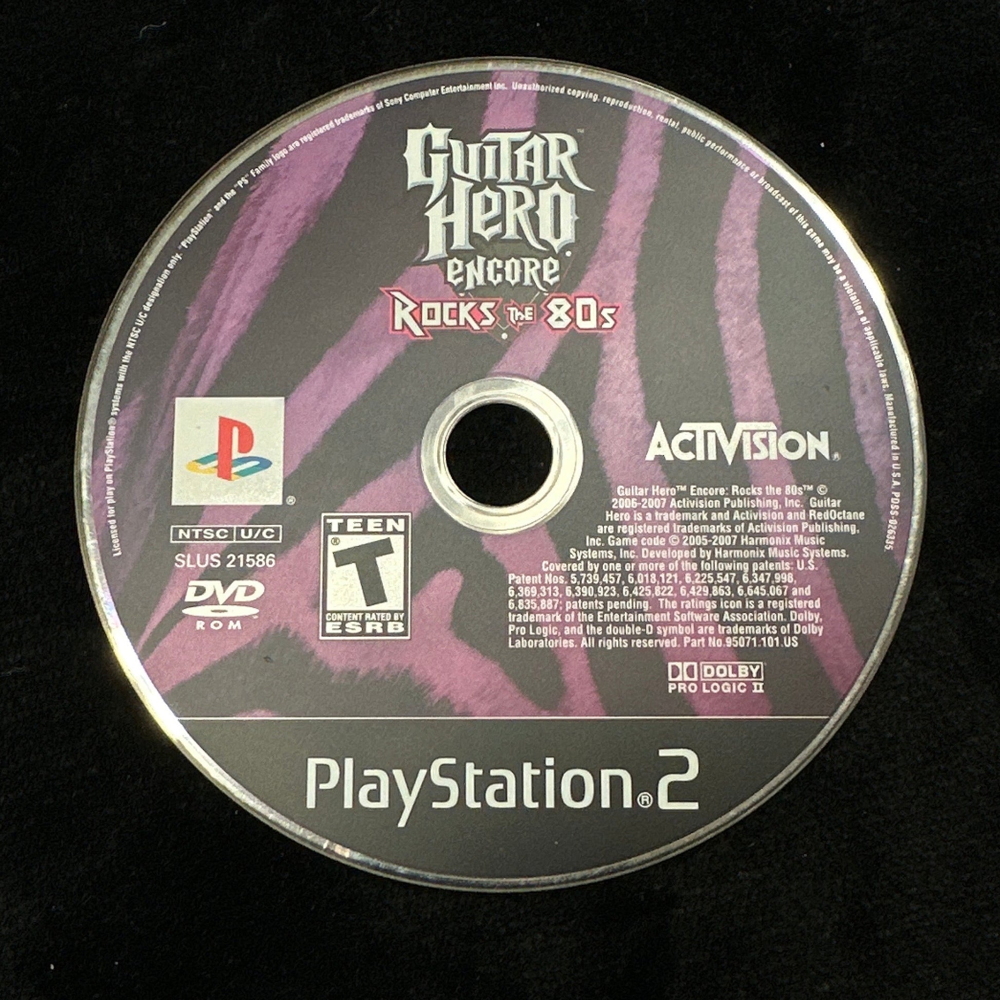 Guitar Hero game disc for PlayStation 2 on a black background
