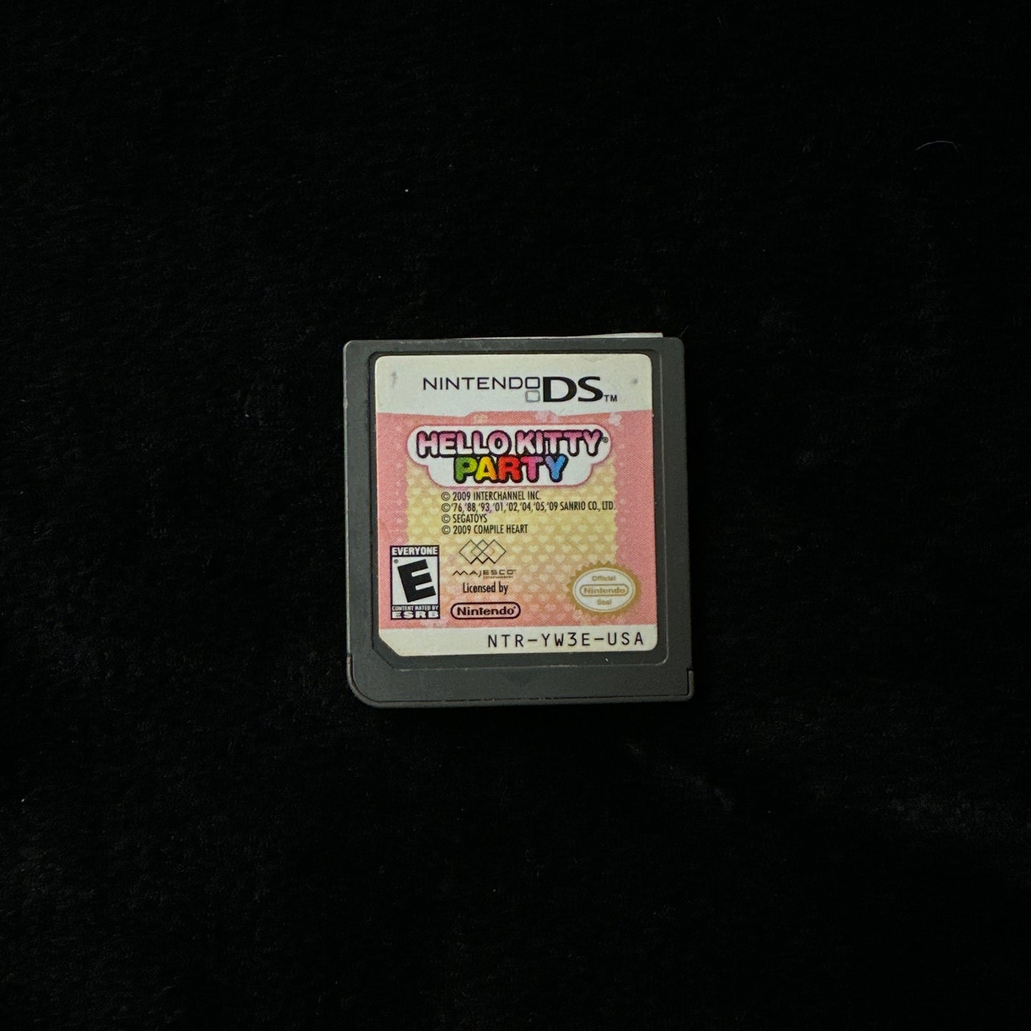 Nintendo DS game cartridge on a black background