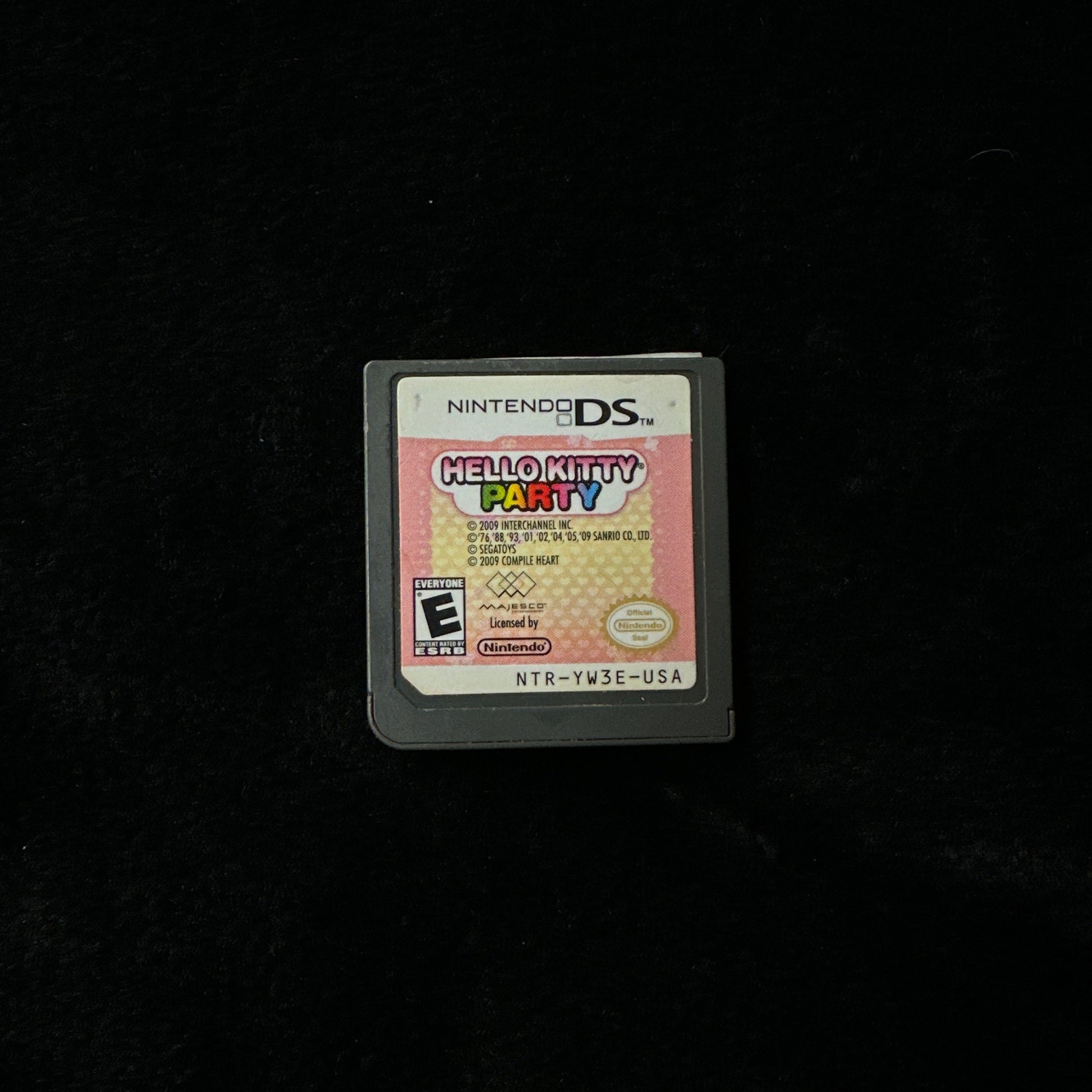 Nintendo DS game cartridge on a black background