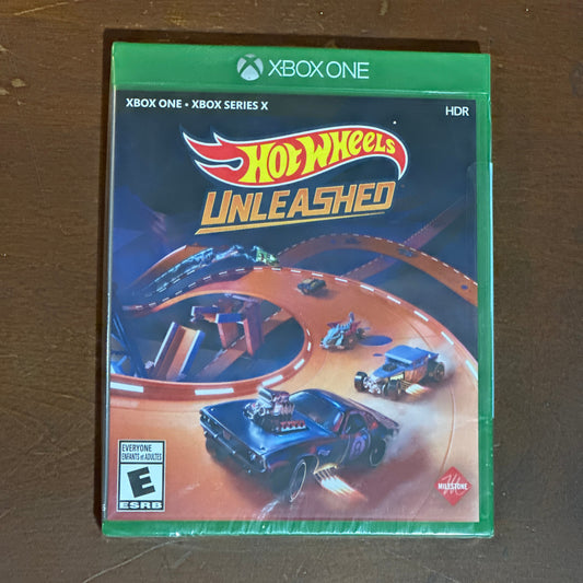 Hot Wheels Unleashed game case for Xbox One on a brown surface