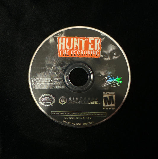A single Nintendo GameCube game disc for 'Hunter: The Reckoning' resting on a black fabric background.