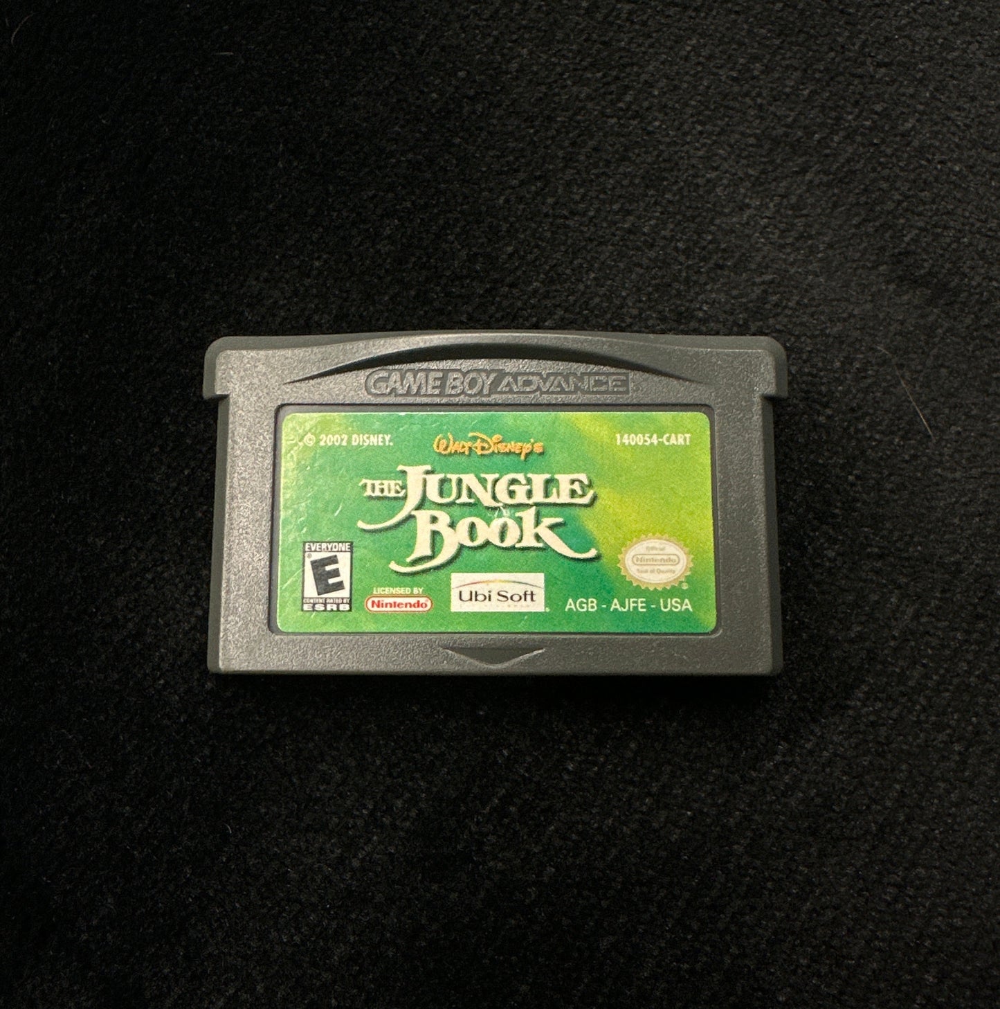 Game cartridge for 'The Jungle Book' on a black background