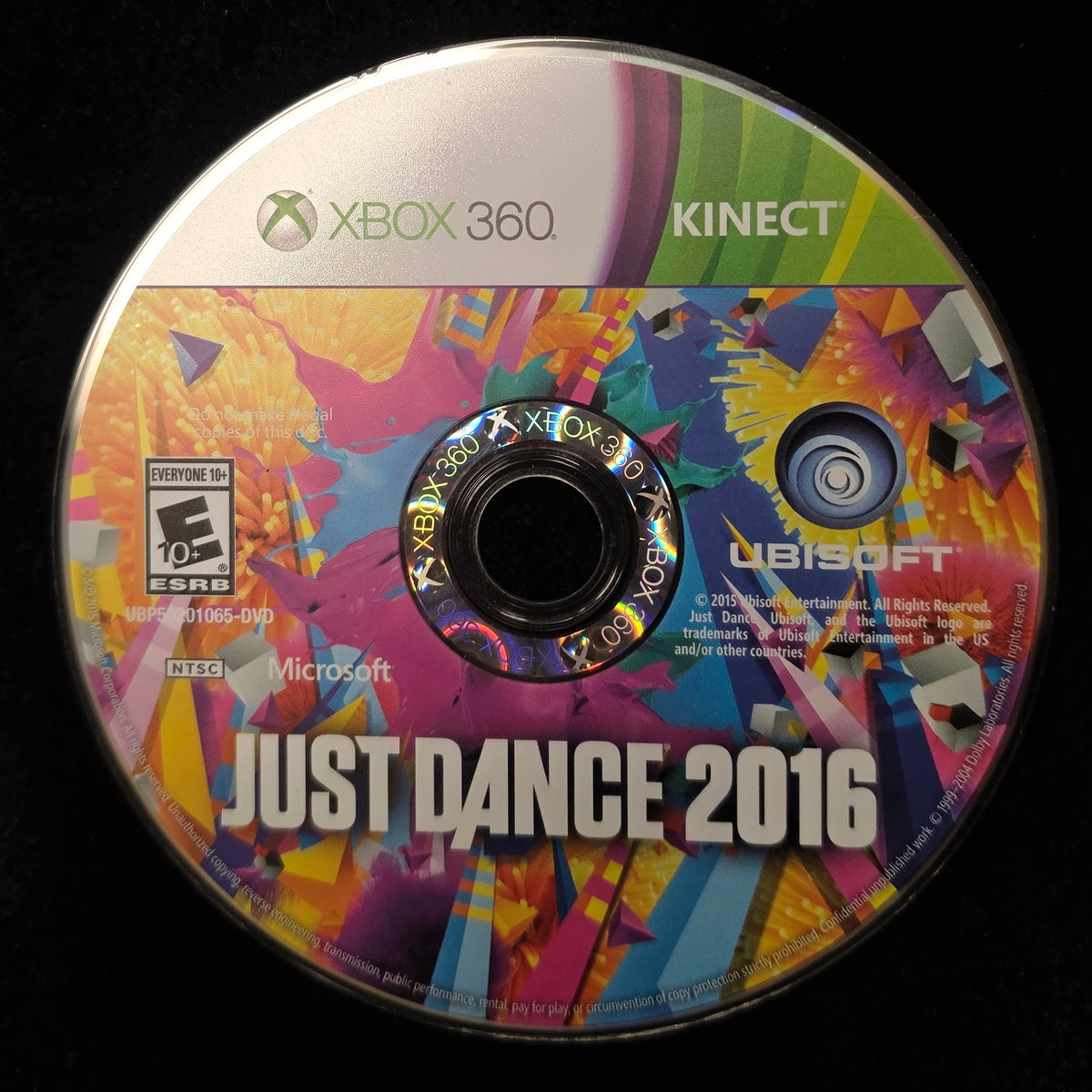 A single Xbox 360 Kinect version of the video game Just Dance 2016, featuring a vibrant multicolor cover art design, resting on a black surface.