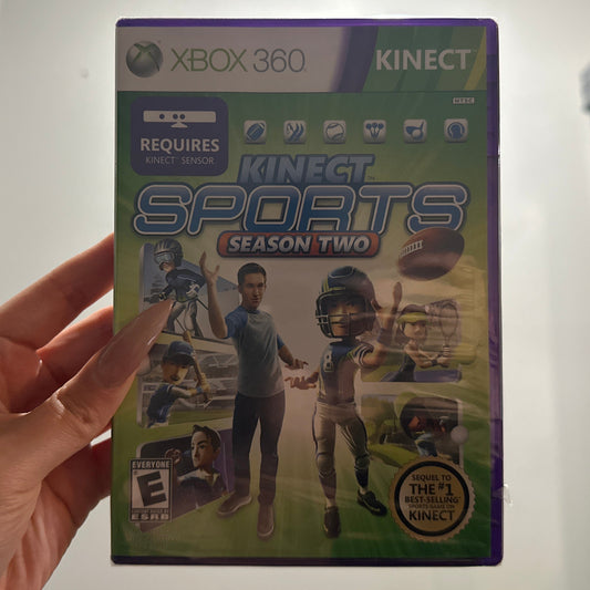 Xbox 360 Kinect Sports Season Two game box held in front of a white wall.