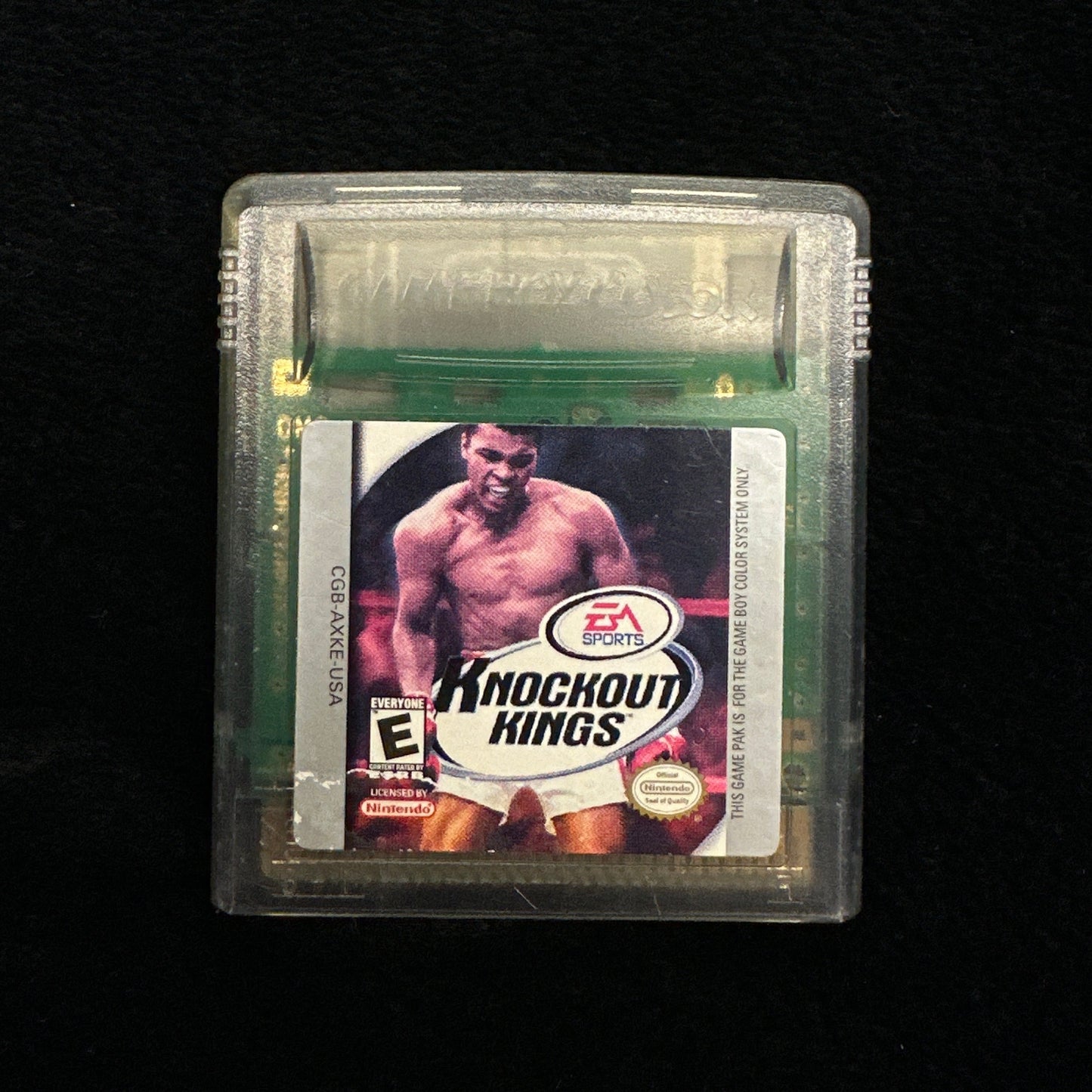 Game cartridge with a boxing-themed label on a black background