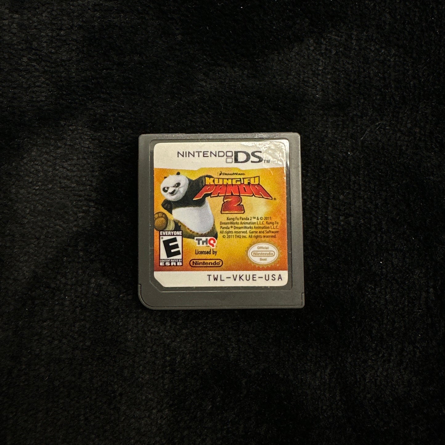 Nintendo DS game cartridge on a black background