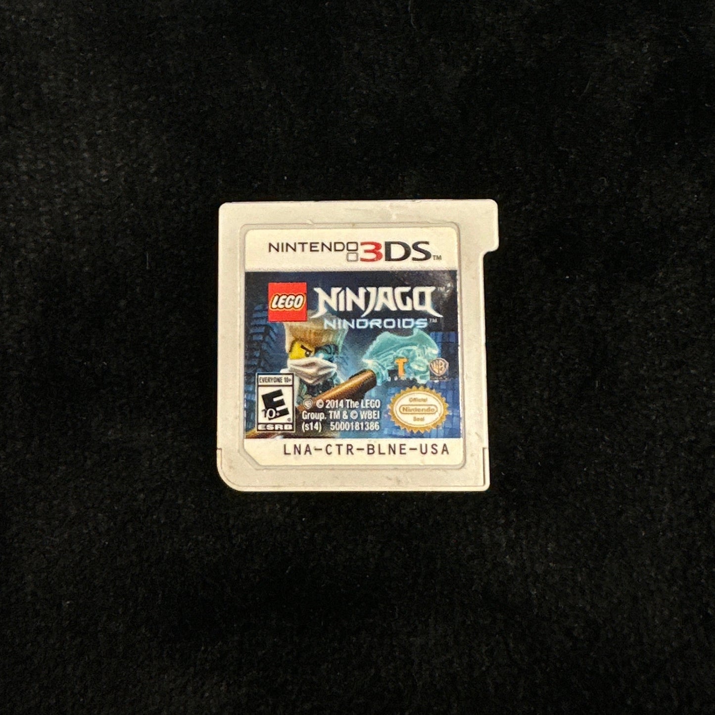 Three Nintendo 3DS games on a dark surface