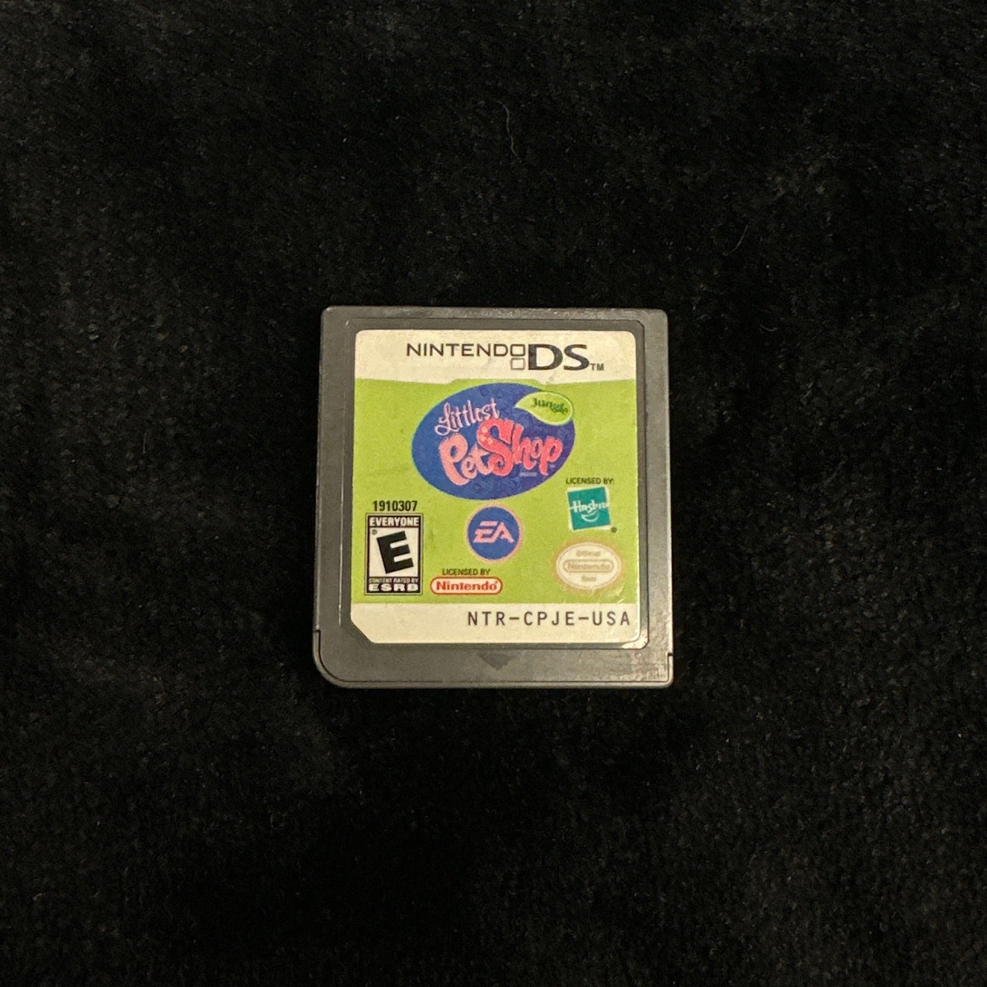 Nintendo DS game cartridge on a dark surface
