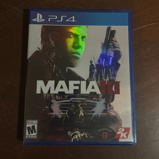 Mafia III game box for PS4 on a wooden surface