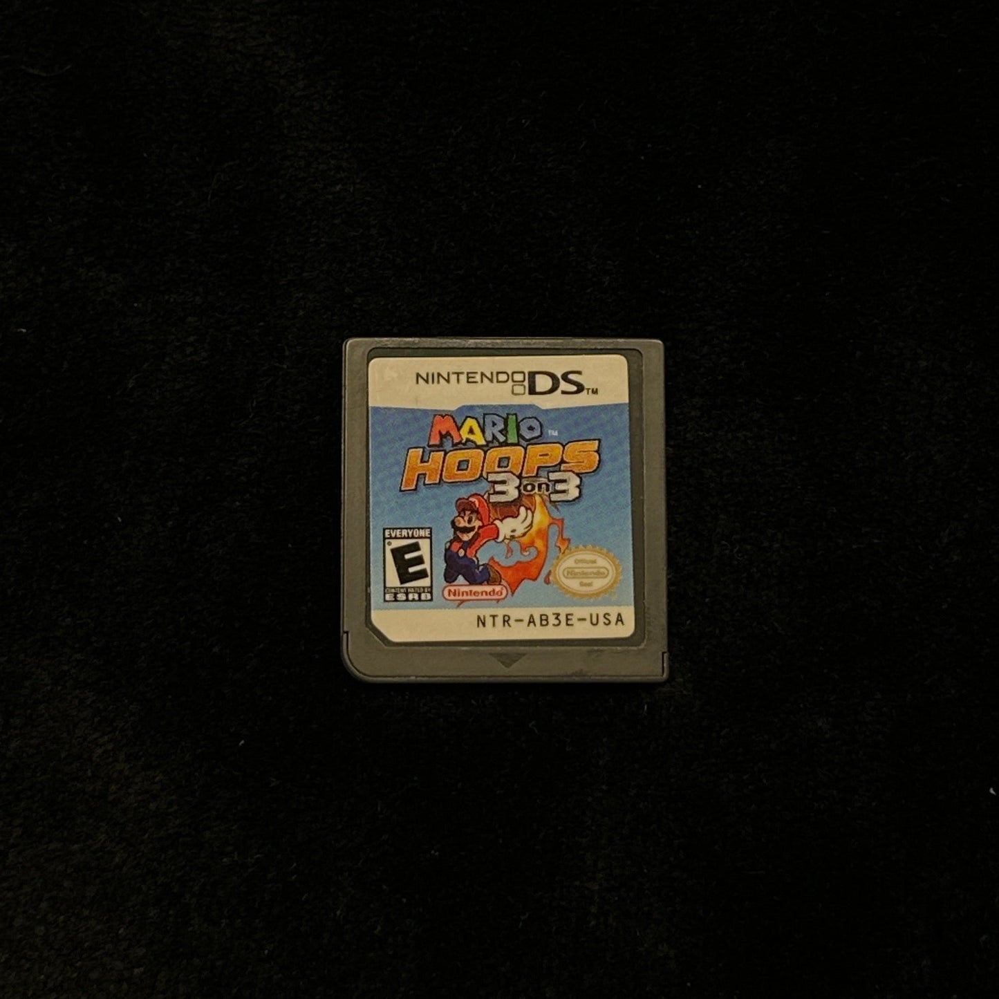 Small game cartridge on a dark surface