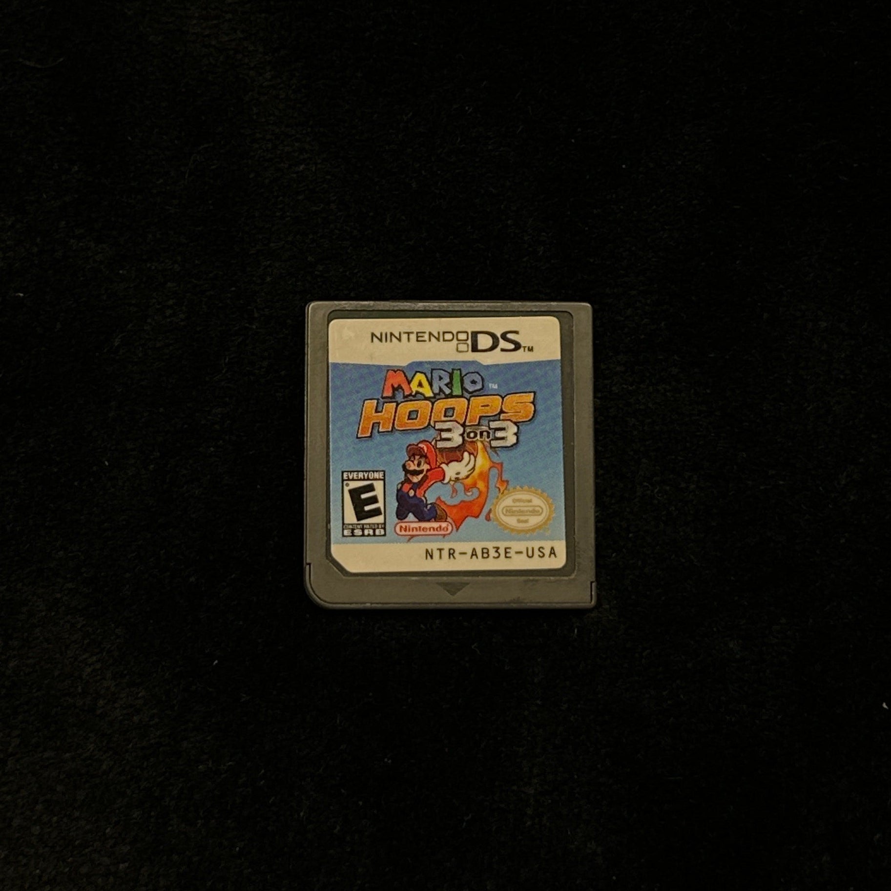 Small game cartridge on a dark surface