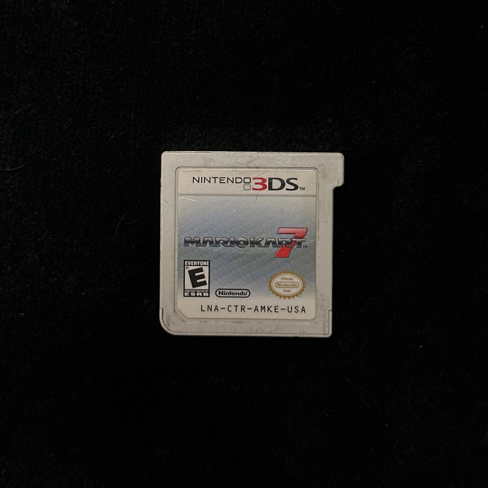 Nintendo 3DS game cartridge on a black background
