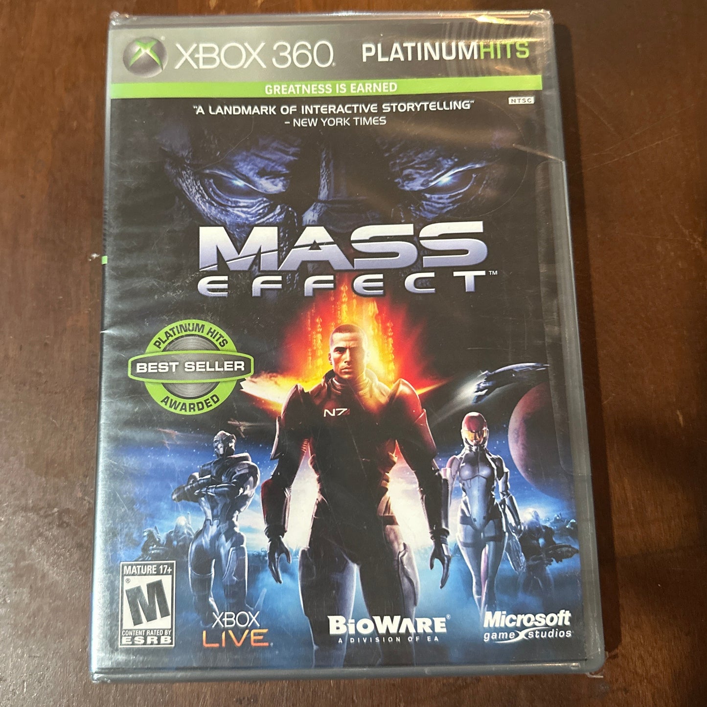 Mass Effect game case for Xbox 360 on a wooden surface