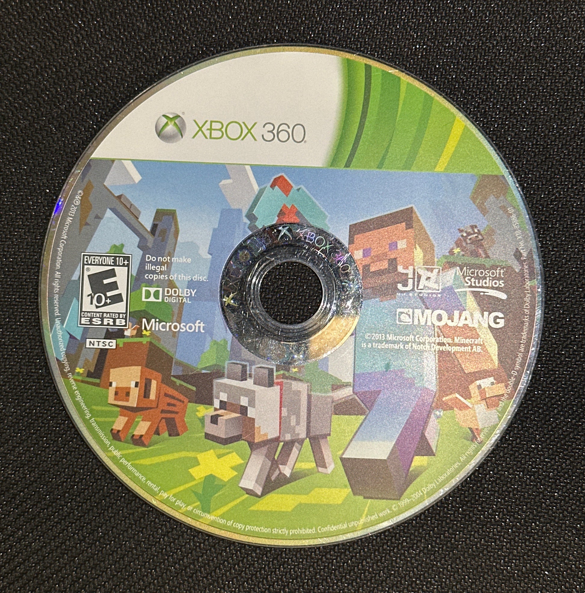 Minecraft Xbox 360 game disc on a black surface