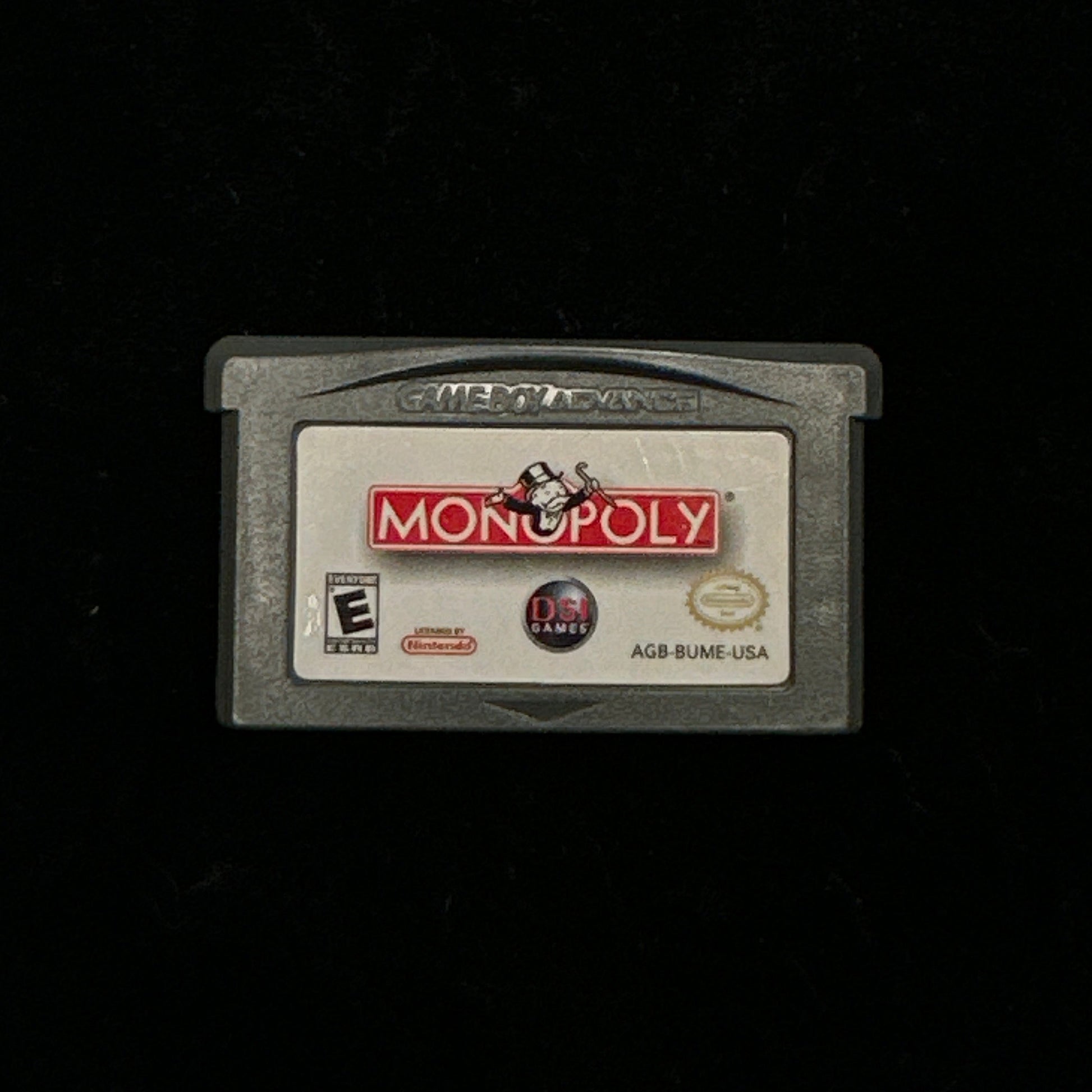 Monopoly game cartridge on a black background