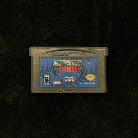 Game cartridge for 'Monster Trucks' on a black background