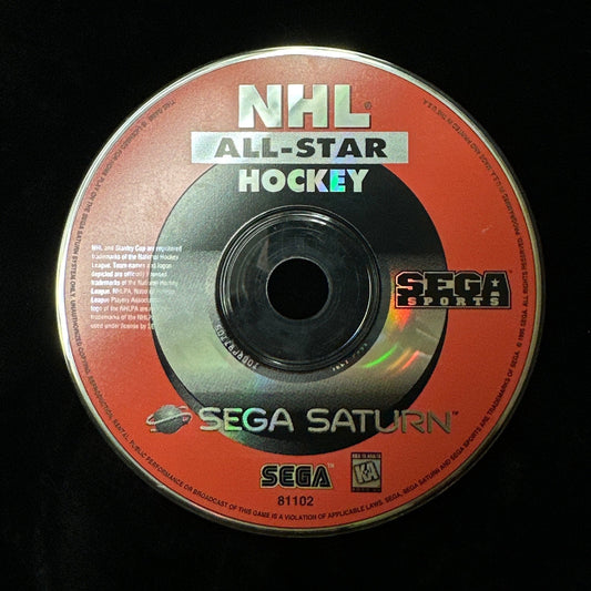 A single NHL All-Star Hockey game disc for Sega Saturn, featuring a bright orange-red label with white and black text, photographed on a dark black fabric background.