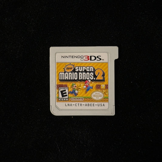 Nintendo 3DS Super Mario Bros. 2 game cartridge on a black background.
