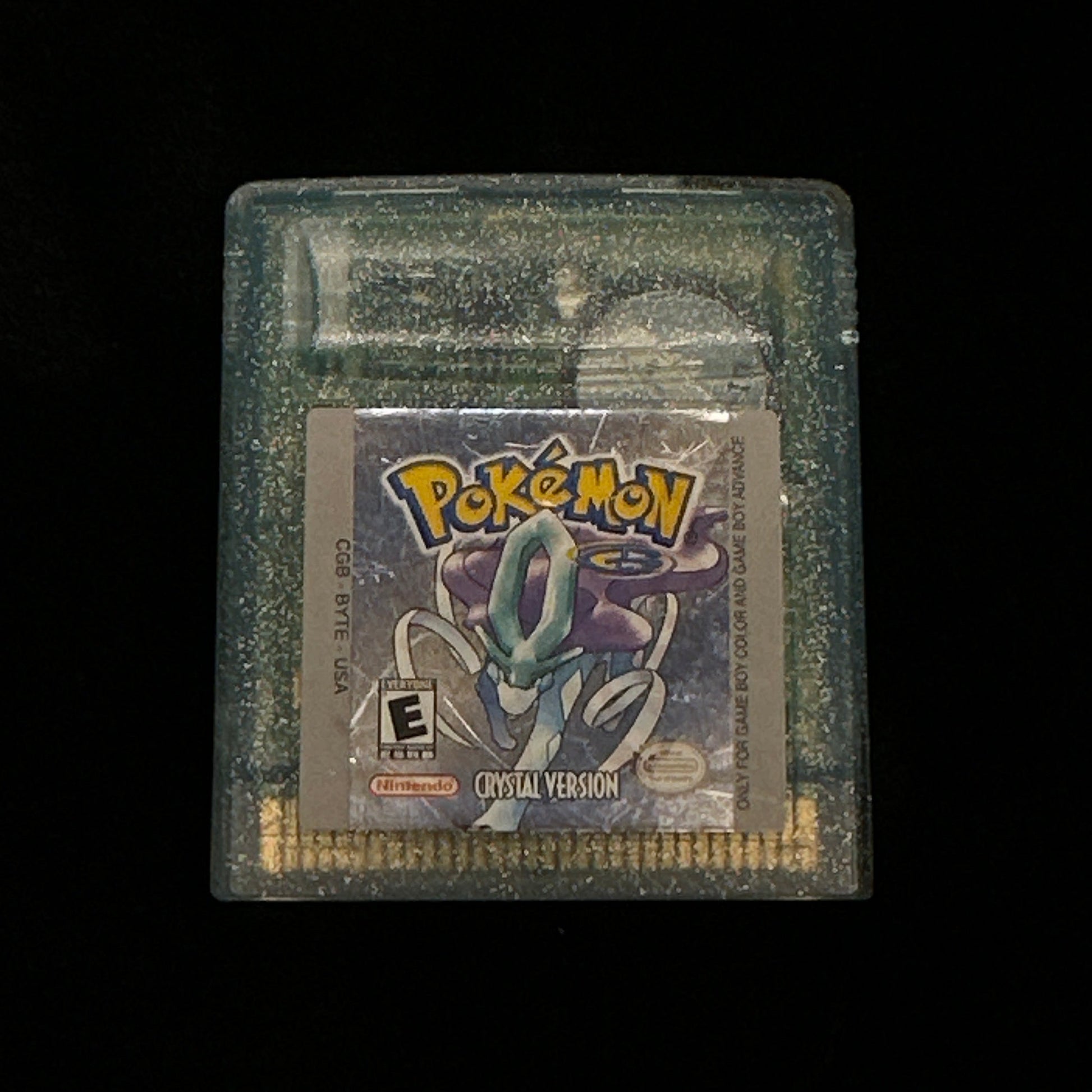 Pokémon game cartridge on a black background