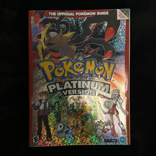 Pokémon guide book titled 'Pokémon Platinum Version' held by a person.