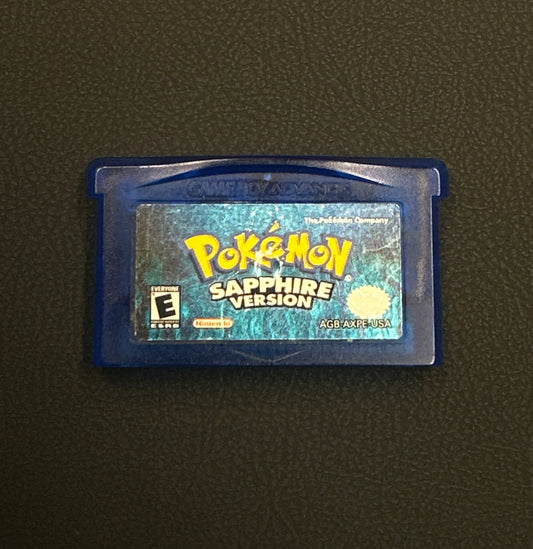 Pokémon Sapphire Version game cartridge on a dark background
