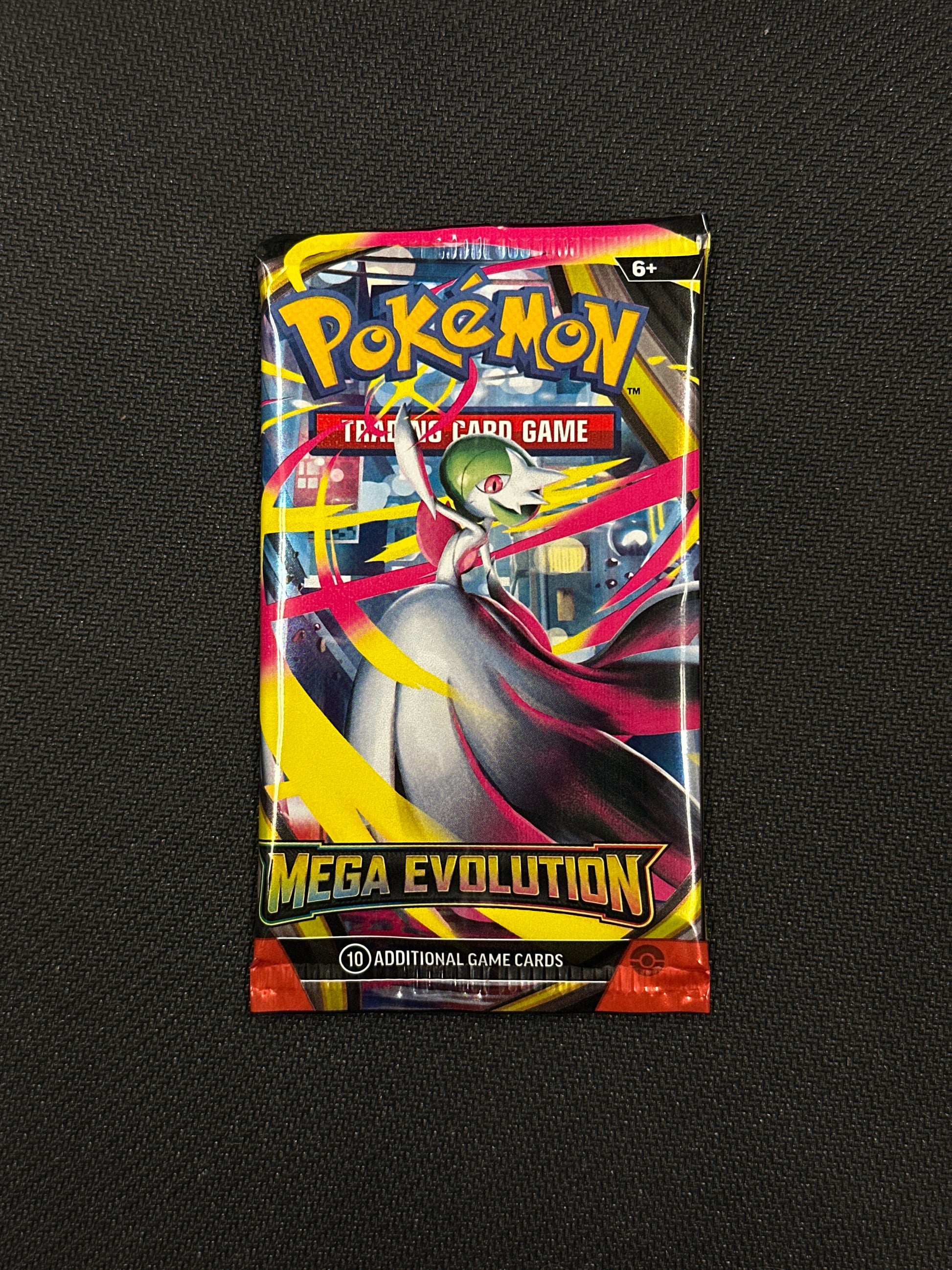 Pokémon trading card game pack on a black background