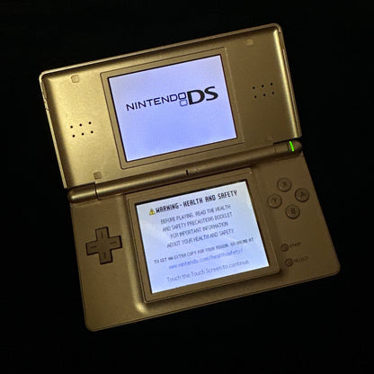 Rose Gold Nintendo DSi Lite open on