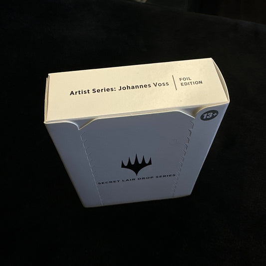 Product packaging box with mtg brand logo on a dark background