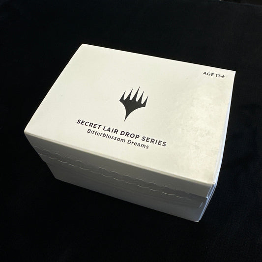 White box with a MTG logo and text on a black background