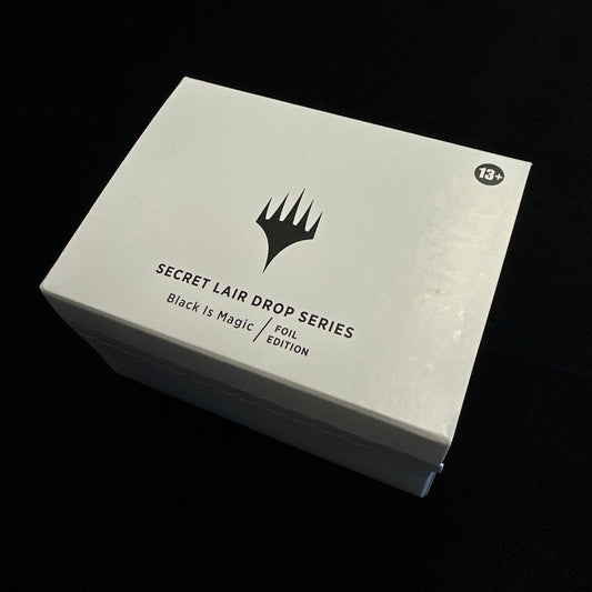 White box with black text and MTG logo on a dark background