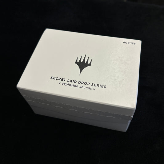 White card box with 'Secret Lair Drop Series' text on a dark background
