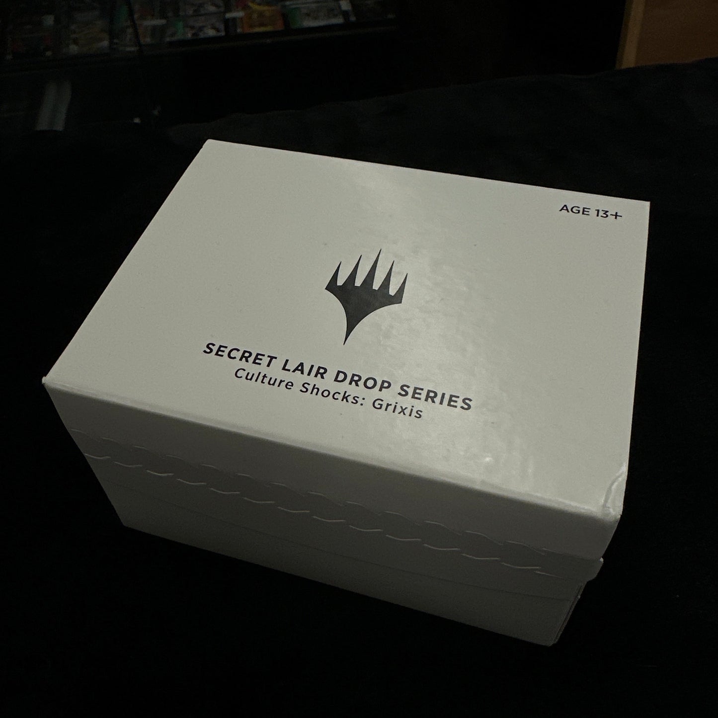 White box with 'Secret Lair Drop Series' text and logo on a dark background