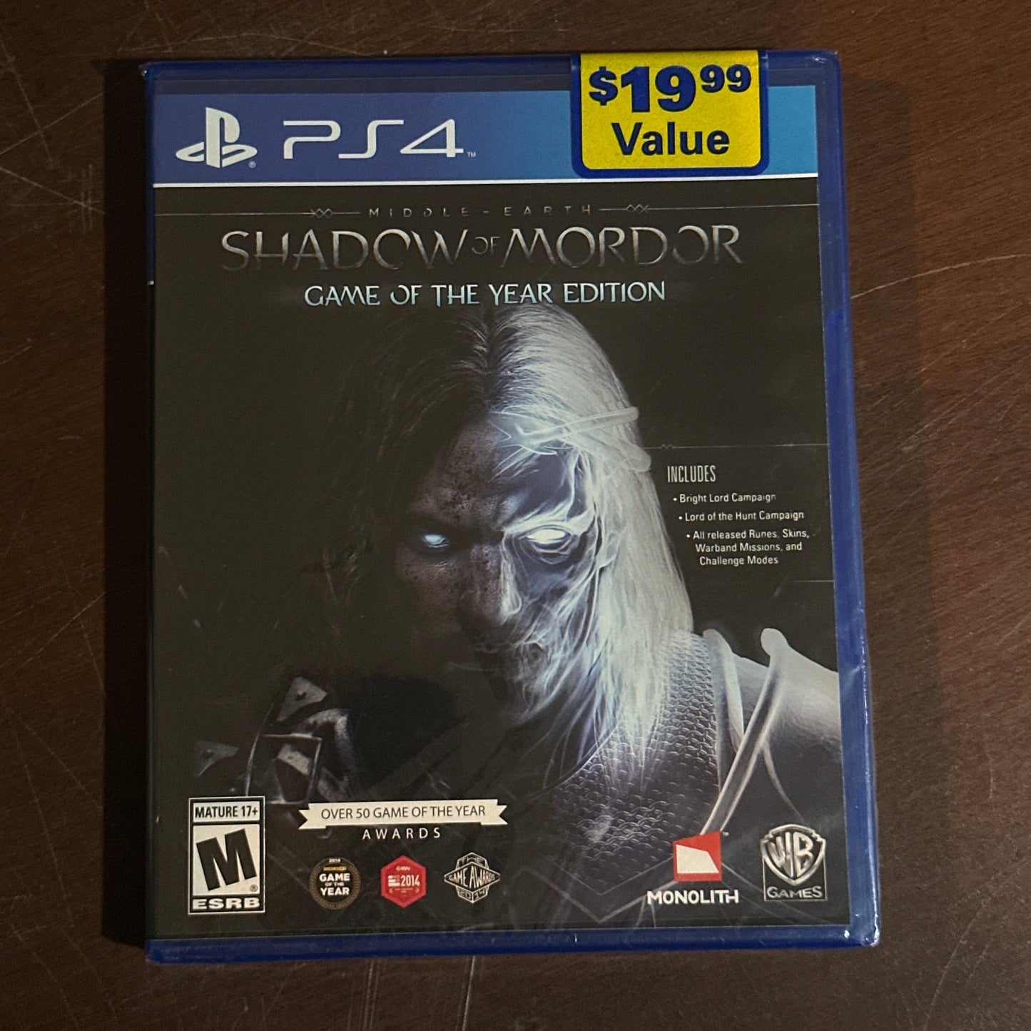 PlayStation 4 game case for 'Shadow of Mordor' on a brown surface