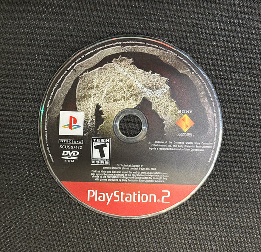 PlayStation 2 game disc on a textured black surface