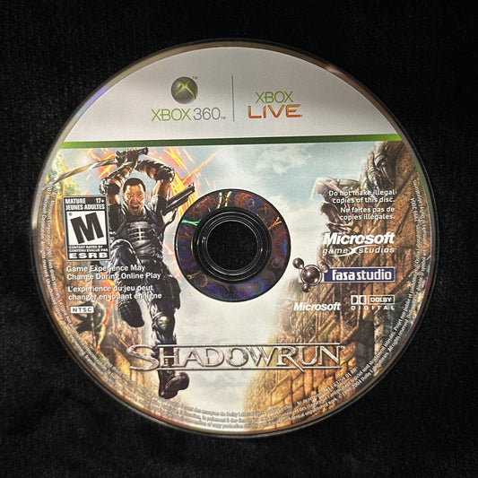 Game disc for 'Shadowrun' on Xbox 360 with branding and graphics.